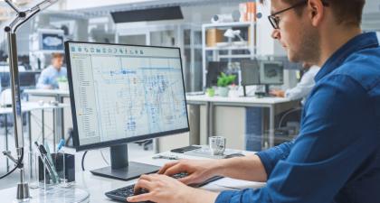 Young Engineer working on Computer 