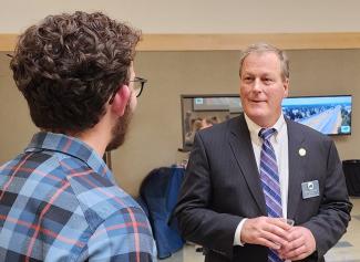 BRPELS Director, Ken Fuller, PE talks with a student