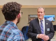 BRPELS Director, Ken Fuller, PE talks with a student