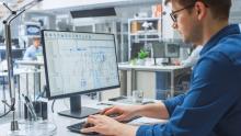 Young Engineer working on Computer 